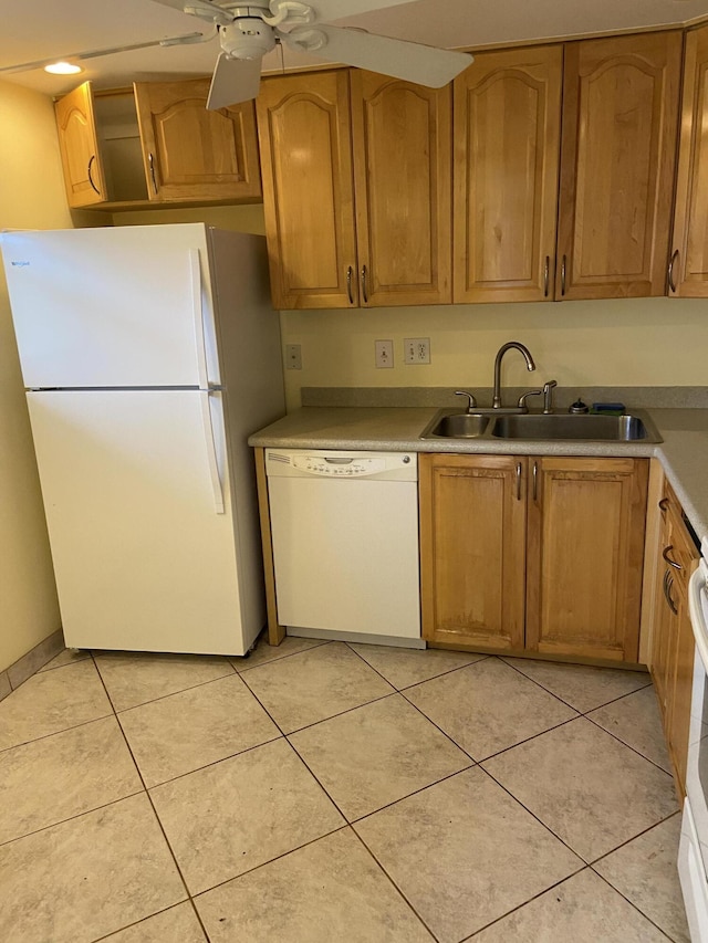 kitchen with ceiling fan, light tile patterned floors, sink, and white appliances