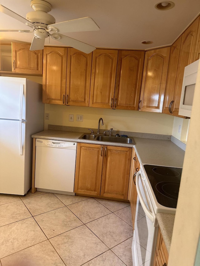 kitchen featuring ceiling fan, light tile patterned flooring, sink, and white appliances