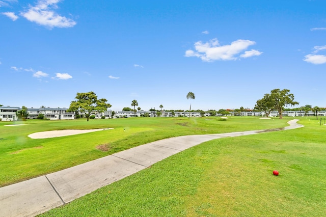 surrounding community featuring a lawn