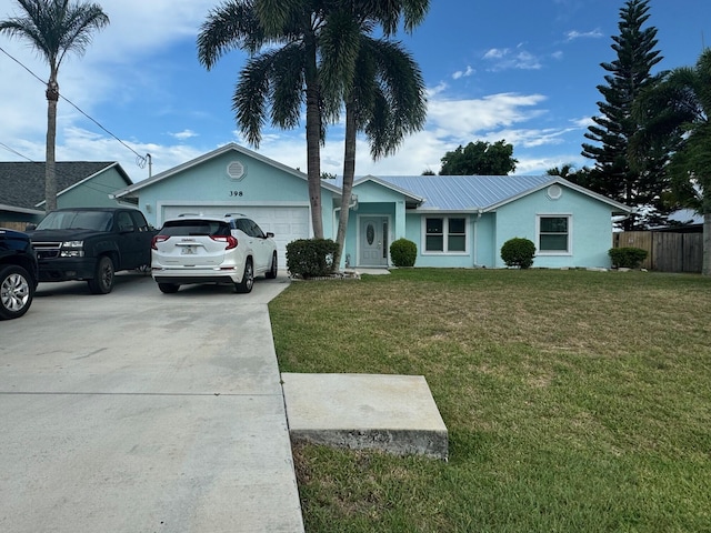 single story home featuring a garage and a front yard