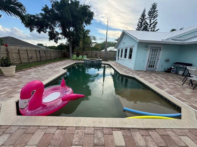 view of swimming pool featuring a patio area