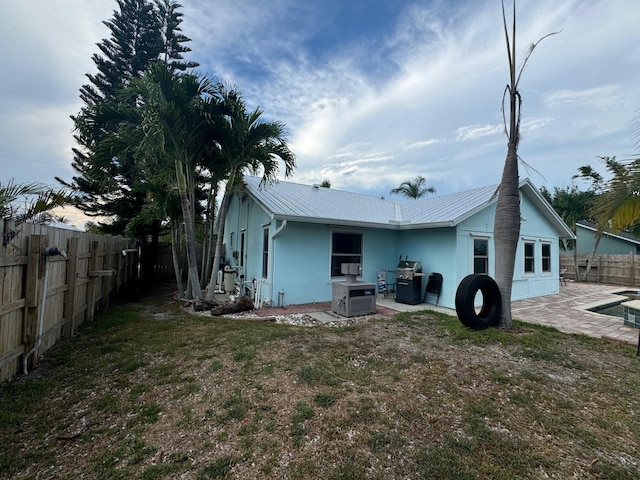 rear view of house with a patio area