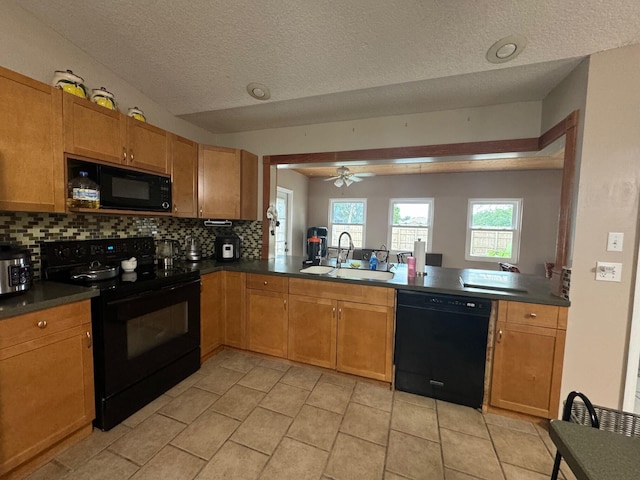 kitchen featuring black appliances, backsplash, sink, light tile flooring, and ceiling fan