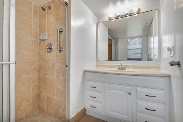 bathroom with vanity and an enclosed shower