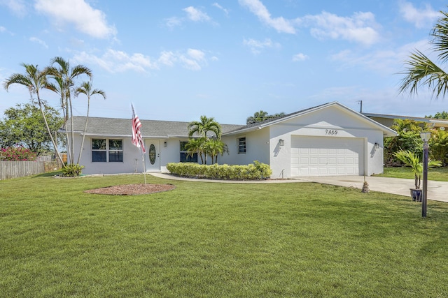 single story home featuring a garage and a front yard