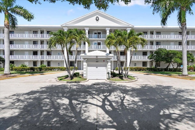 view of building exterior with a garage and driveway