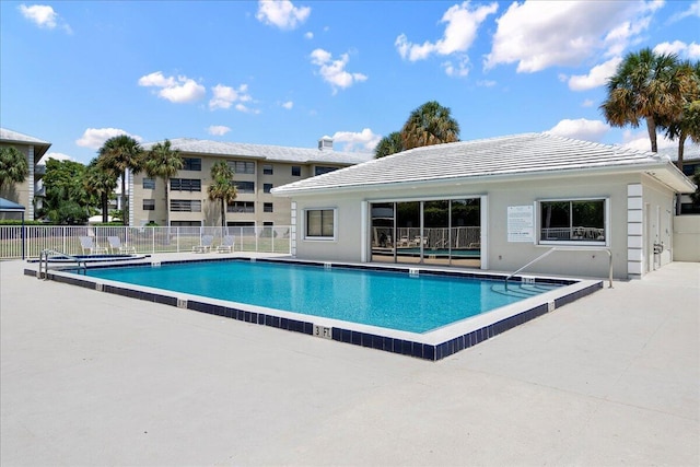 pool featuring a patio and fence