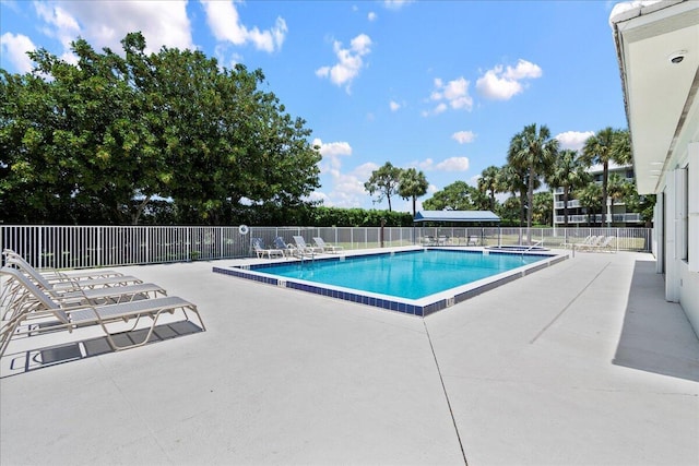 pool featuring a patio and fence