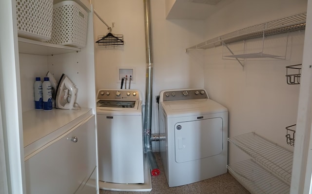 washroom featuring washing machine and dryer