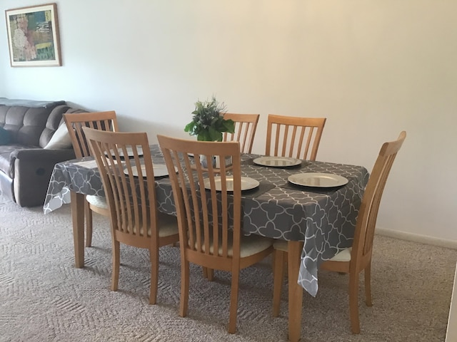 view of carpeted dining area