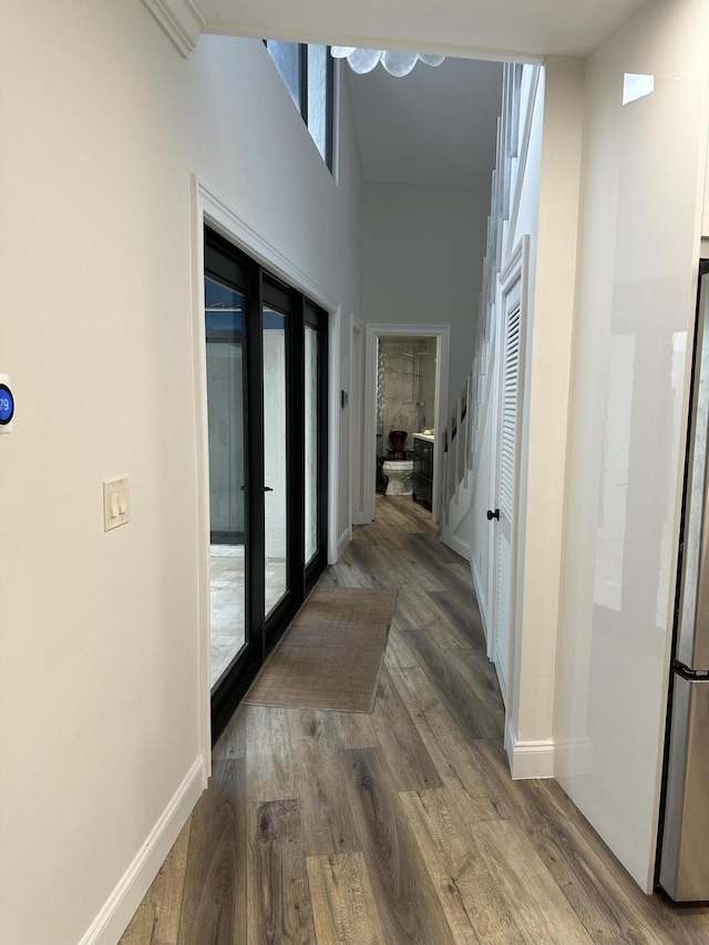 hall featuring hardwood / wood-style floors and french doors