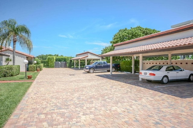 view of vehicle parking featuring a carport