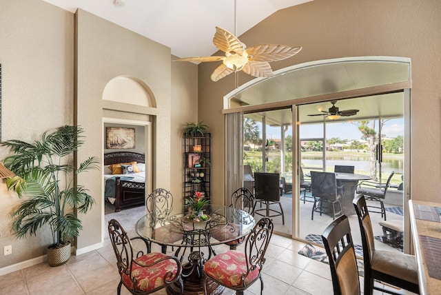 dining area with ceiling fan, a wealth of natural light, and light tile patterned flooring