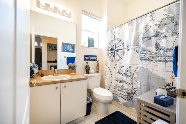 bathroom featuring tile patterned flooring, vanity, a shower with shower curtain, and toilet