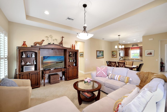 living area featuring light tile patterned floors, baseboards, visible vents, a chandelier, and recessed lighting