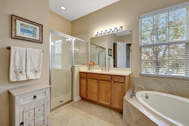 bathroom featuring separate shower and tub, a wealth of natural light, and vanity