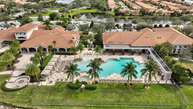 drone / aerial view with a residential view and a water view