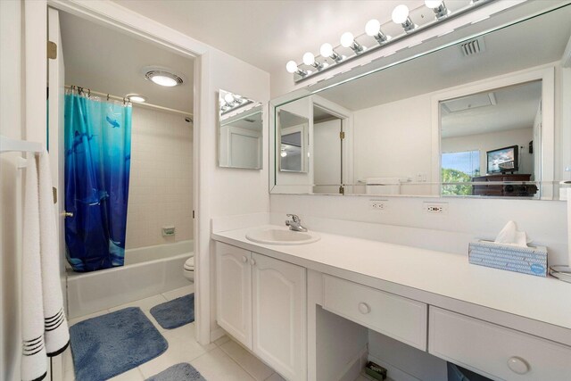 1600 NE Dixie Hwy Unit 10-205, Jensen Beach, FL 34957 - bathroom with tile patterned floors, vanity, toilet, and shower / bath combination with curtain