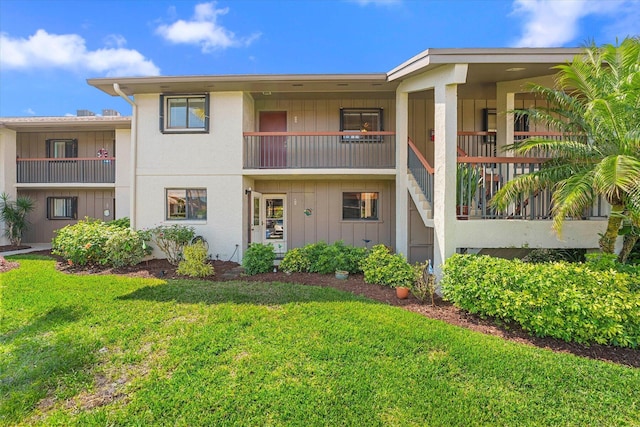 1600 NE Dixie Hwy Unit 10-205, Jensen Beach, FL 34957 - view of front of home featuring a front lawn