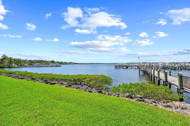 1600 NE Dixie Hwy Unit 10-205, Jensen Beach, FL 34957 - dock area featuring a water view and a yard