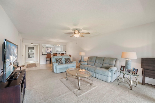 carpeted living room featuring ceiling fan