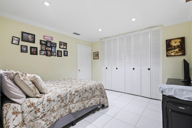 bedroom with light tile patterned floors and crown molding