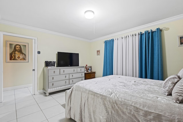 bedroom with ornamental molding and light tile patterned flooring