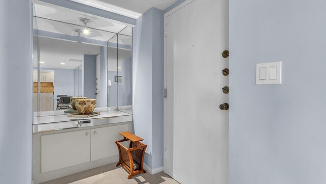 bathroom with vanity and tile floors