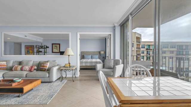 living room featuring tile floors, crown molding, and expansive windows