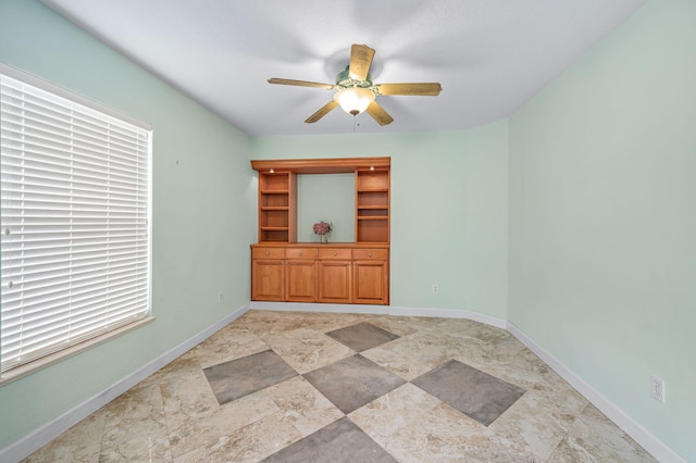 spare room featuring ceiling fan