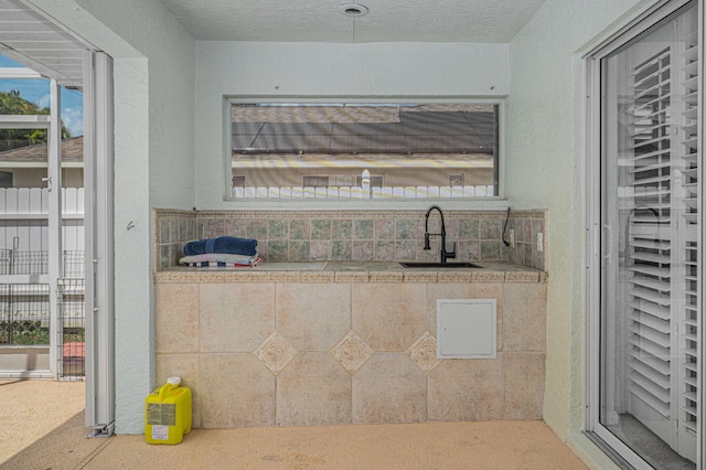 interior space with carpet flooring and sink