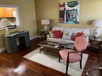 living room with dark wood-type flooring