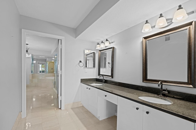 bathroom featuring vanity and a shower with shower door