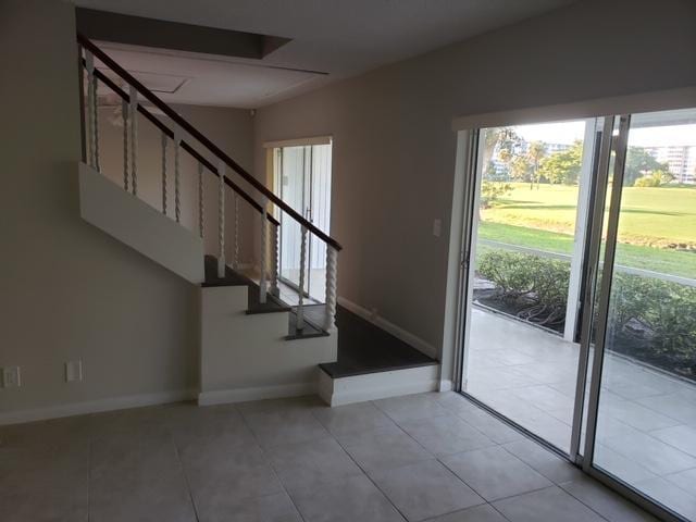 entryway featuring light tile patterned flooring