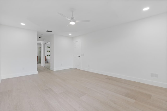 spare room featuring ceiling fan and light hardwood / wood-style floors