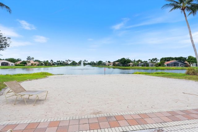 surrounding community with a water view