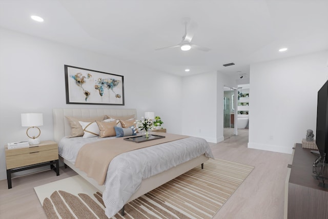 bedroom featuring light hardwood / wood-style floors and ceiling fan