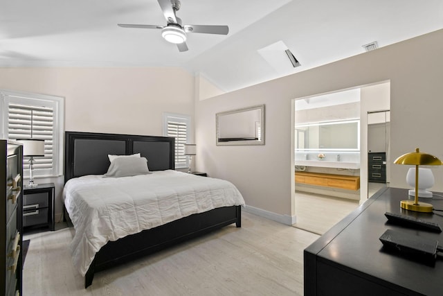 bedroom with ceiling fan, vaulted ceiling, and light wood-type flooring