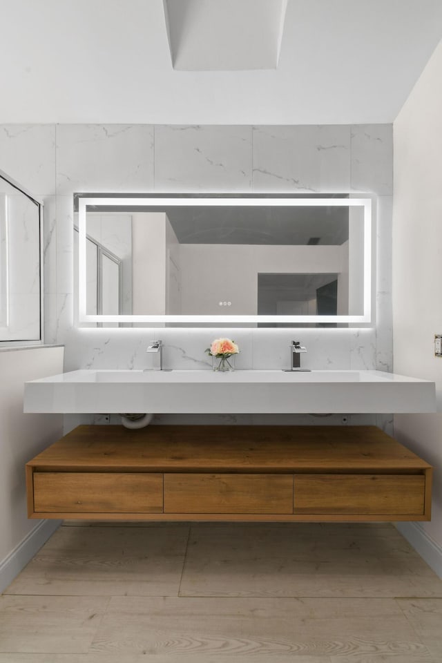 bathroom featuring vanity and hardwood / wood-style flooring