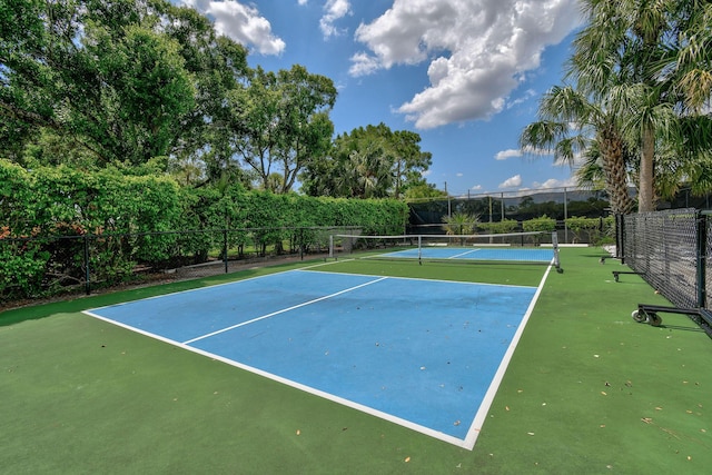 view of tennis court featuring basketball court