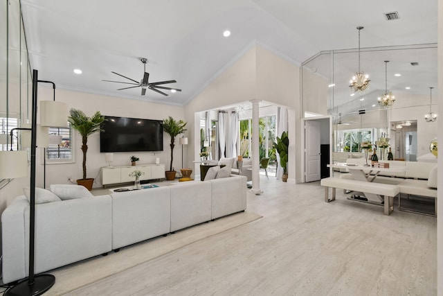 living room featuring ceiling fan with notable chandelier, crown molding, high vaulted ceiling, and light hardwood / wood-style flooring