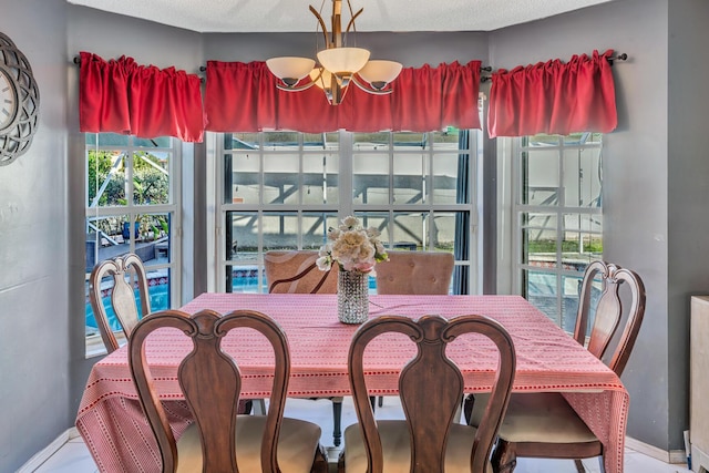 dining space with a chandelier