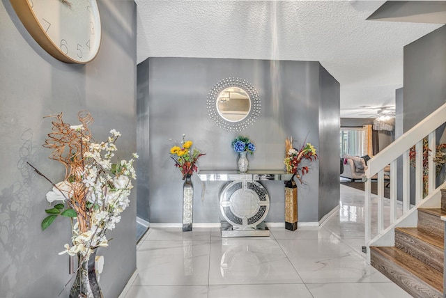 entrance foyer featuring a textured ceiling