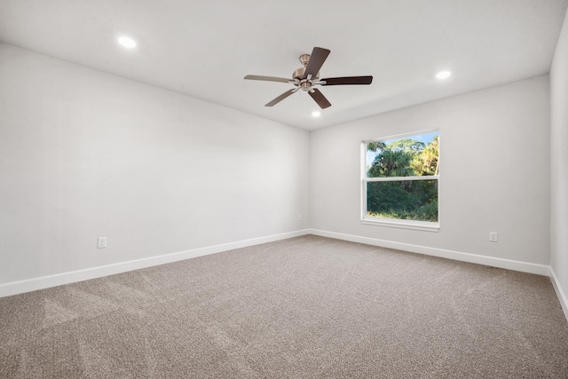 carpeted empty room with ceiling fan