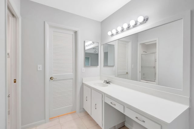 bathroom featuring tile patterned flooring and vanity