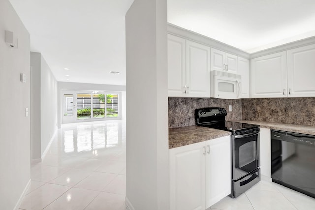 kitchen with black appliances, decorative backsplash, light tile patterned flooring, and white cabinets