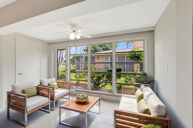 sunroom featuring ceiling fan