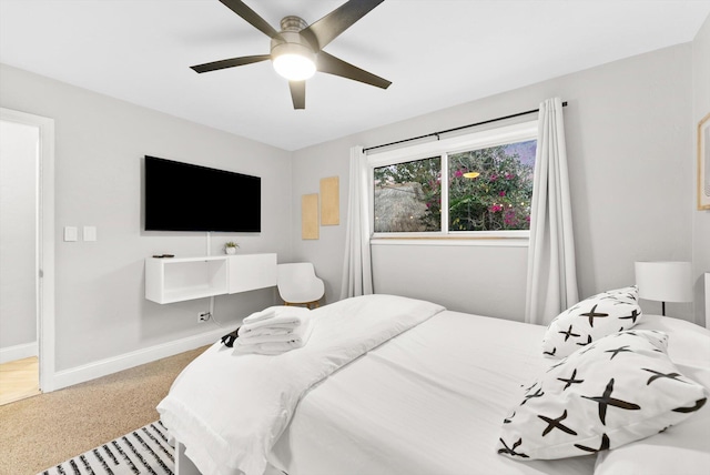 bedroom with ceiling fan and carpet