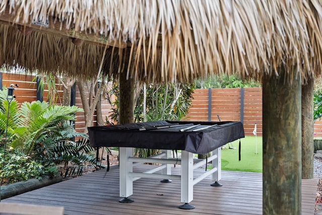 wooden deck with a gazebo and a lawn