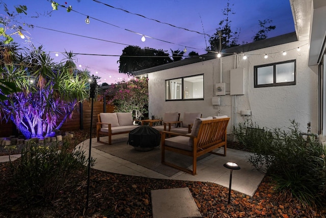 patio terrace at dusk with outdoor lounge area